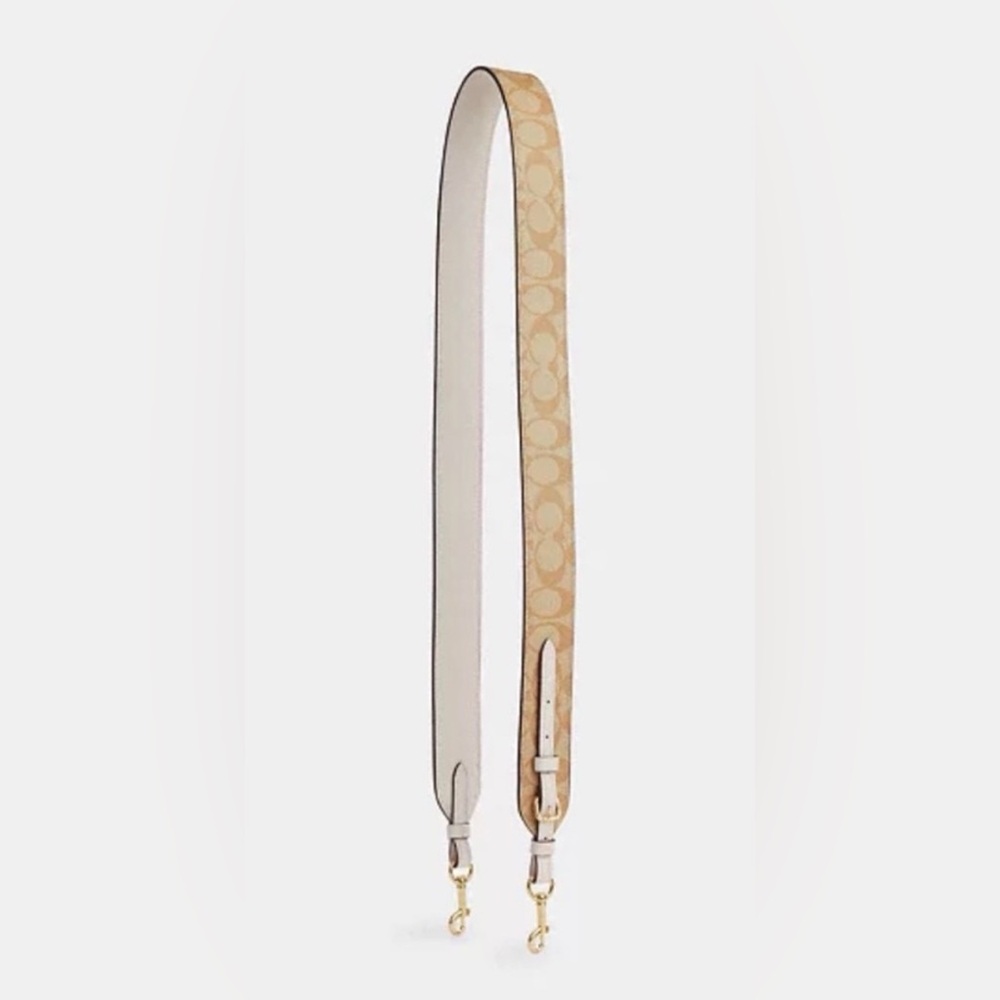 Coach adjustable strap in signature canvas in the color gold/light khaki